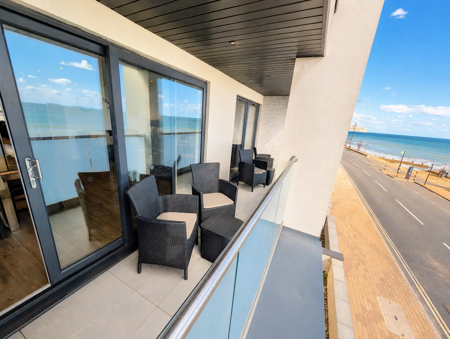 Private balcony with outdoor seating overlooking Sandown seafront